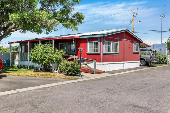 Red exterior with white trim featuring multiple windows
