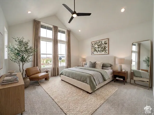 Vaulted ceiling with recessed lighting and a black ceiling fan