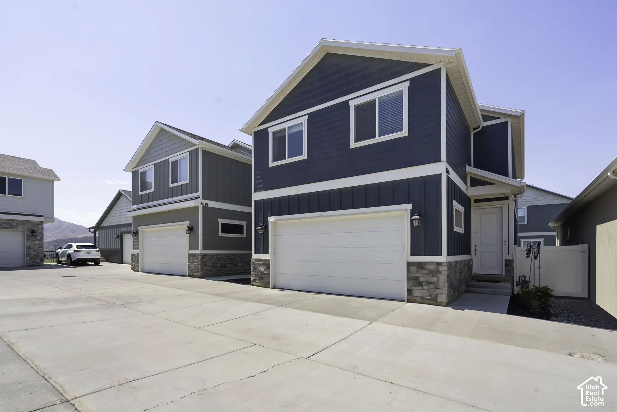 Contemporary house exterior featuring blue vertical and horizontal siding
