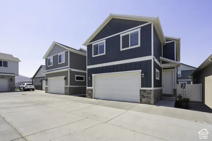 Contemporary house exterior featuring blue vertical and horizontal siding