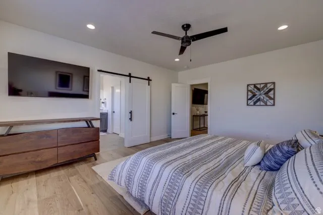 Hardwood-finish flooring, recessed lighting, and a ceiling fan