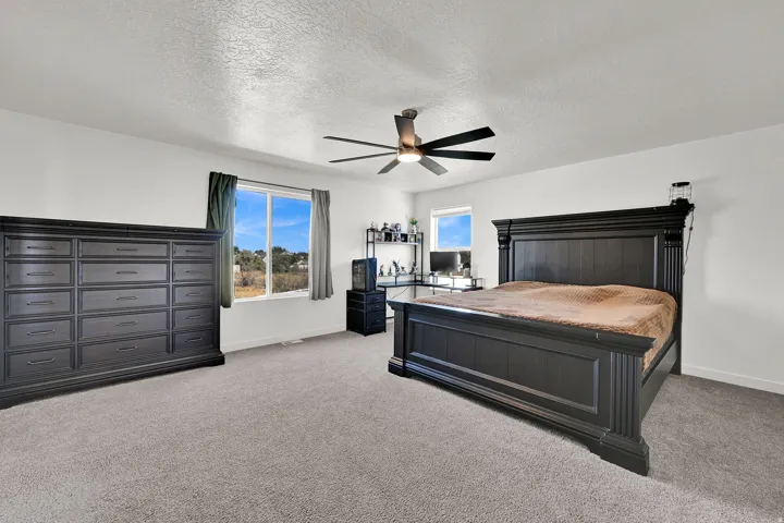 Primary bedroom with a ton of space! Neutral and bright!