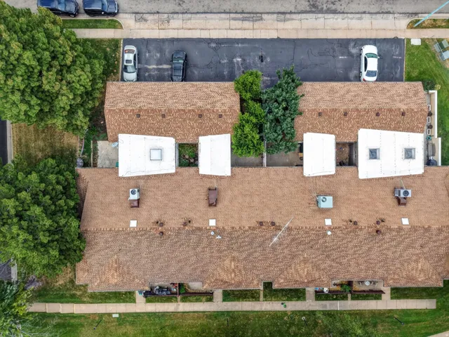 Aerial perspective showcasing a complex of buildings with multiple units
