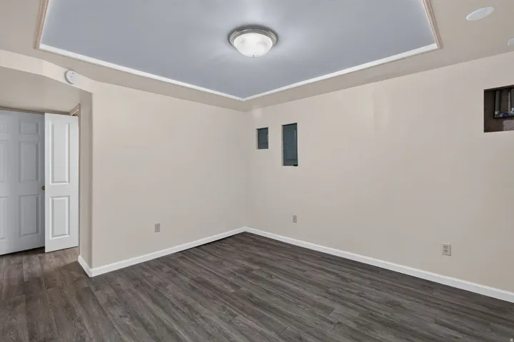 Recessed ceiling detail with central flush-mount lighting