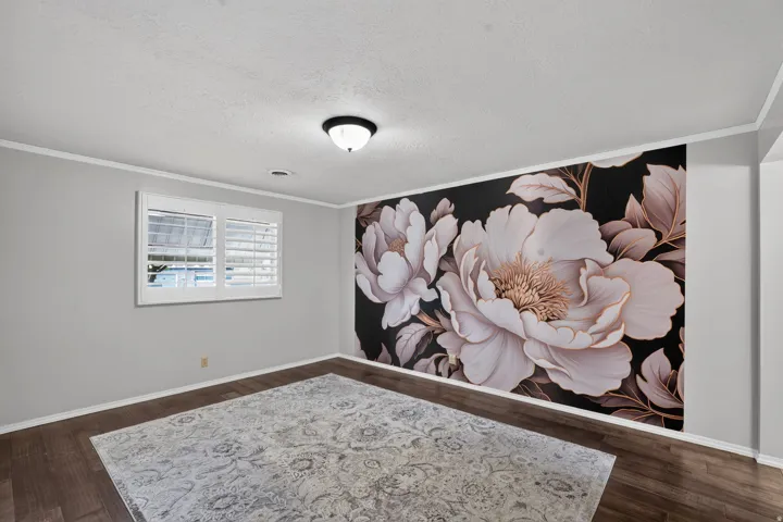 Accent wall featuring a large floral mural