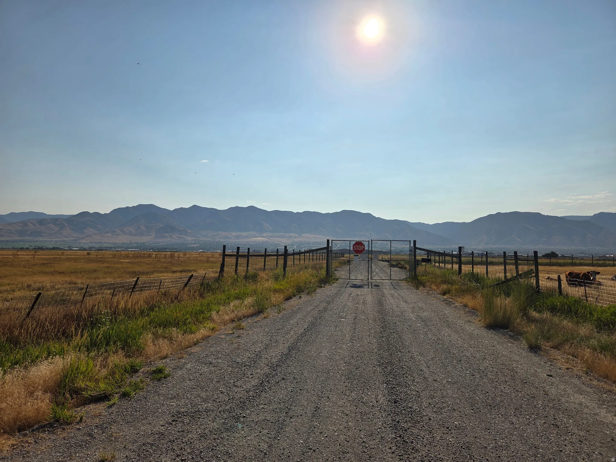 Gravel road entrance to west side of Airport