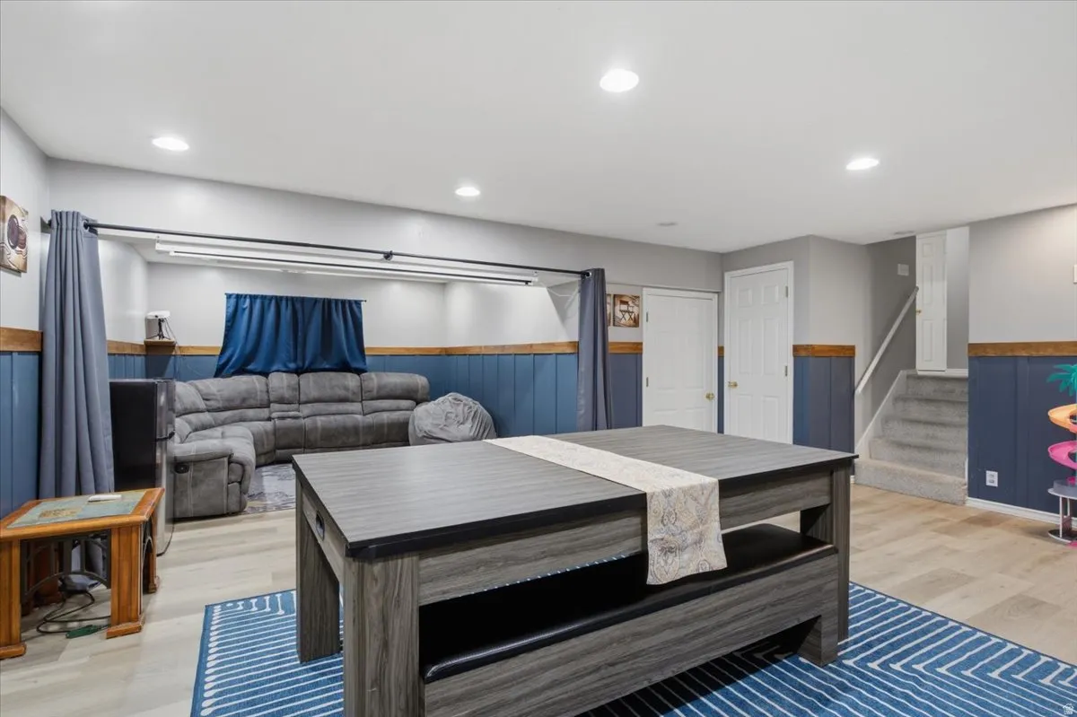 Finished lower level featuring recessed lighting and wood-finish flooring