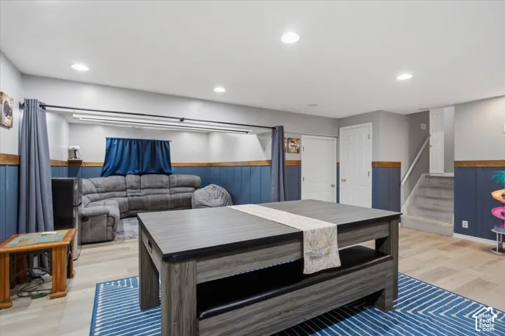 Finished lower level featuring recessed lighting and wood-finish flooring