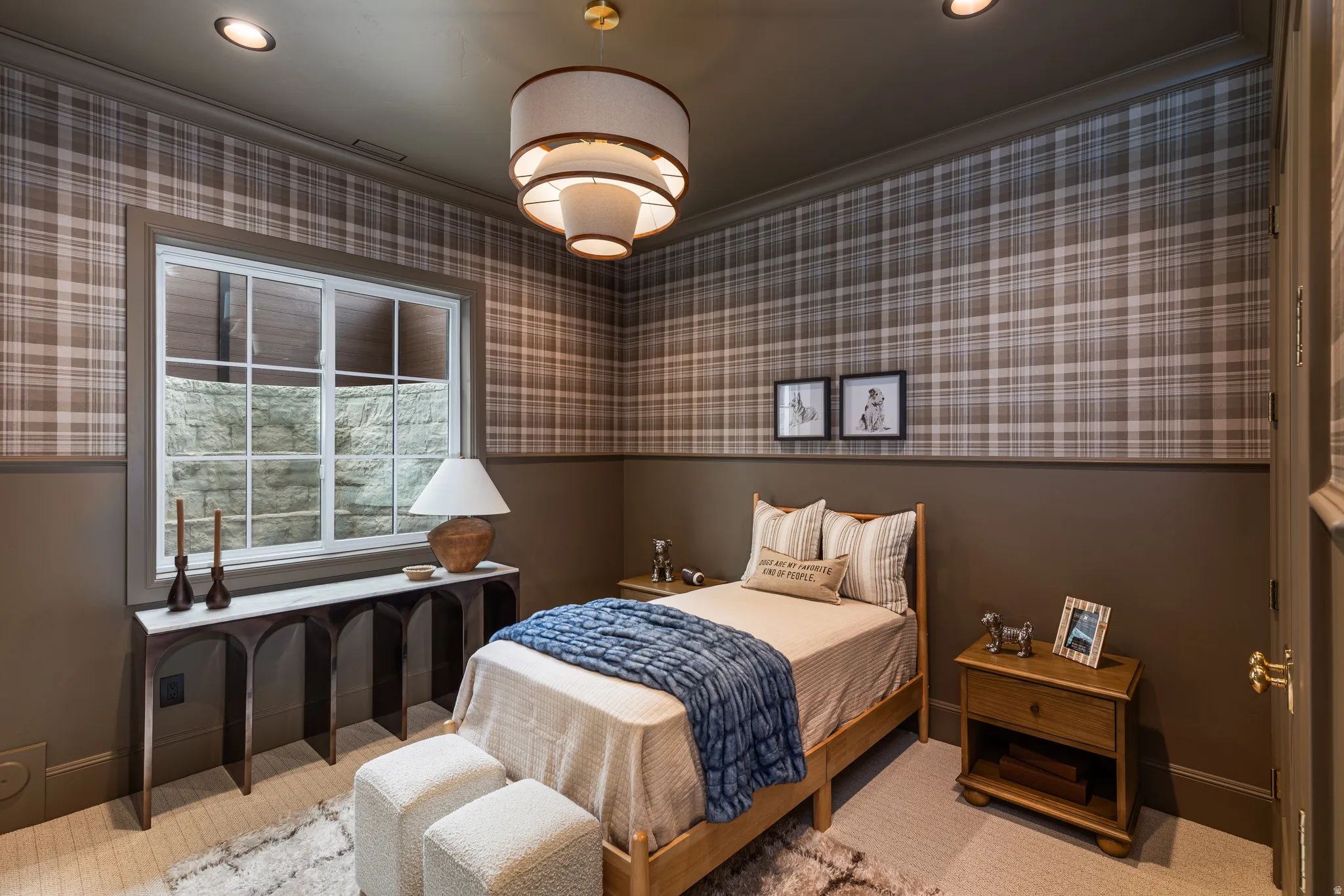 Room featuring plaid wallpaper, recessed lighting, and a tiered drum chandelier