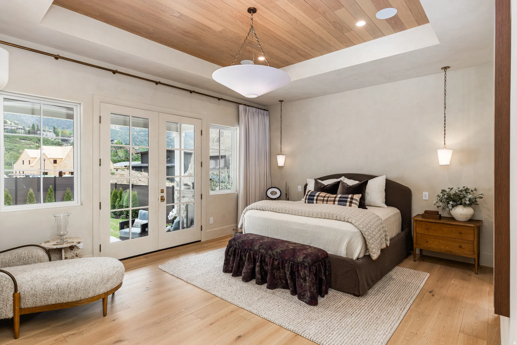 Hardwood flooring enhancing a room with a wood-paneled ceiling