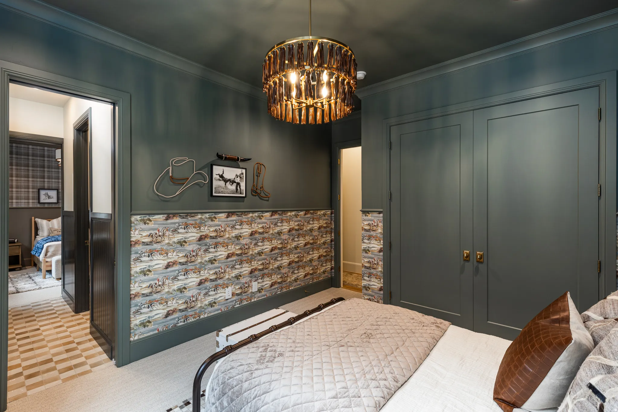 Interior space featuring dark green walls with paneling, patterned wainscoting, and a drum-style ceiling fixture