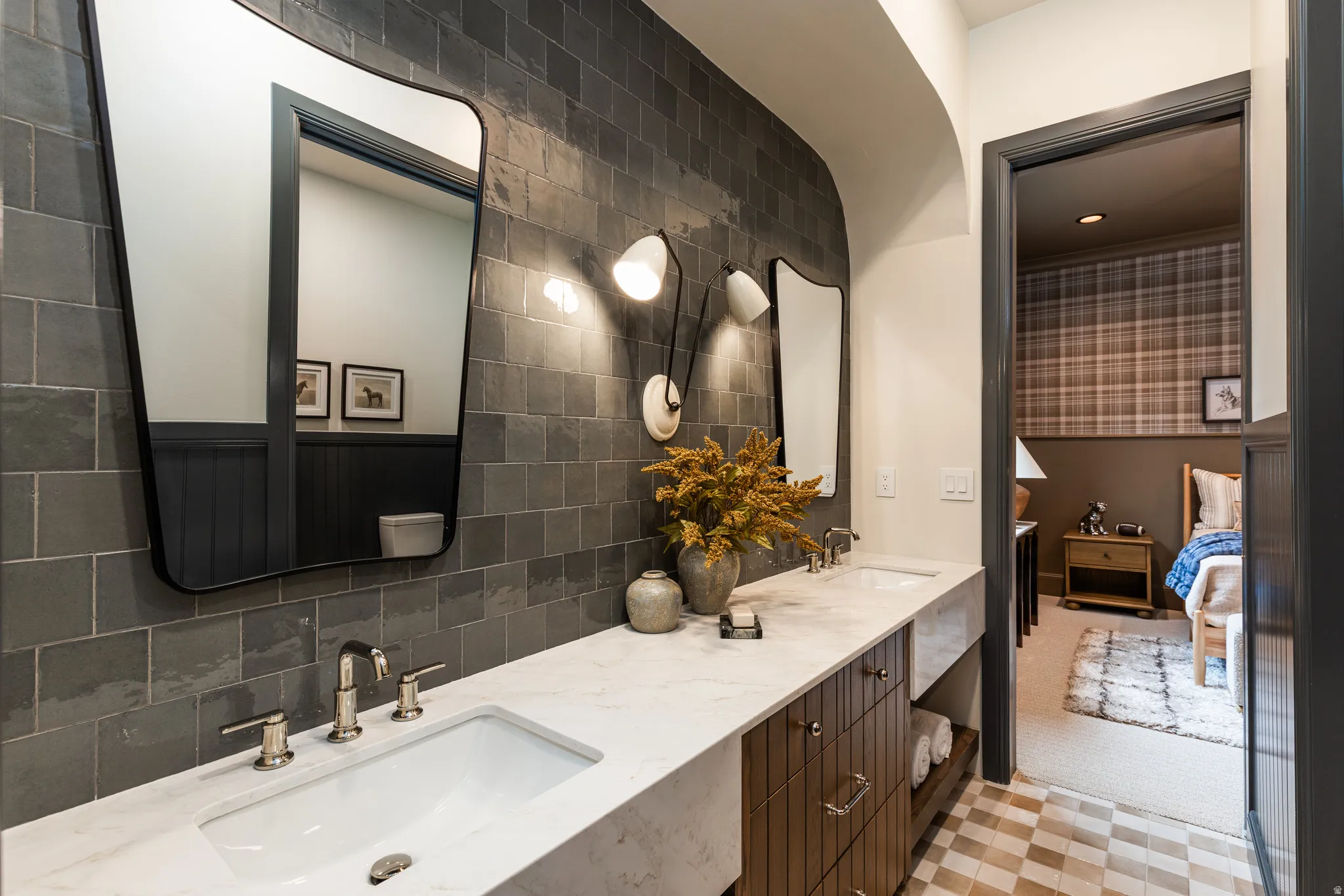 Dual vanity with undermount sinks, polished nickel faucets, and white marble-look countertop