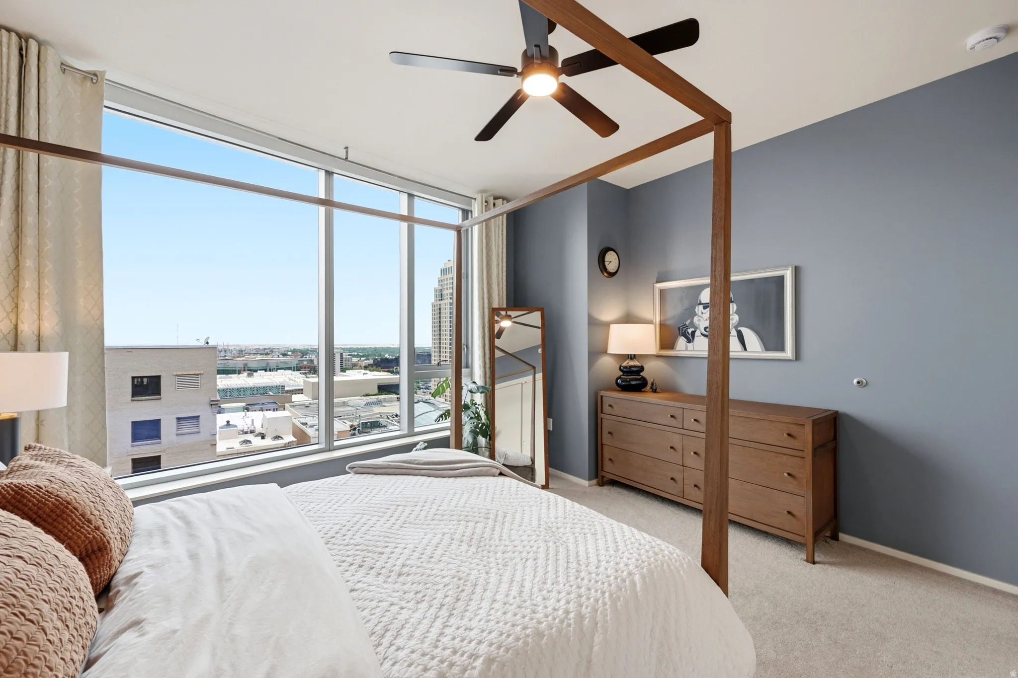 Floor-to-ceiling windows with expansive urban scenery