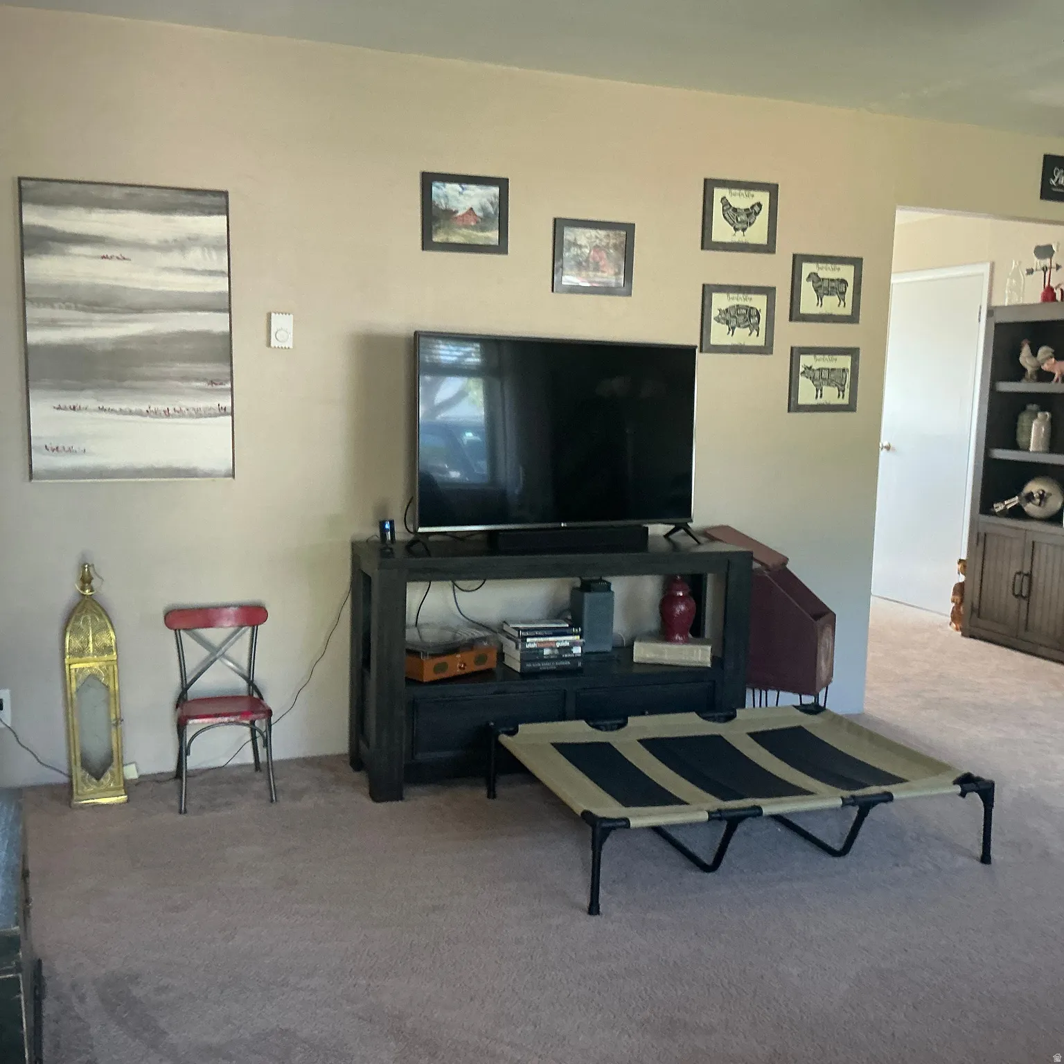 Neutral-toned walls complement the beige carpeting in this interior space