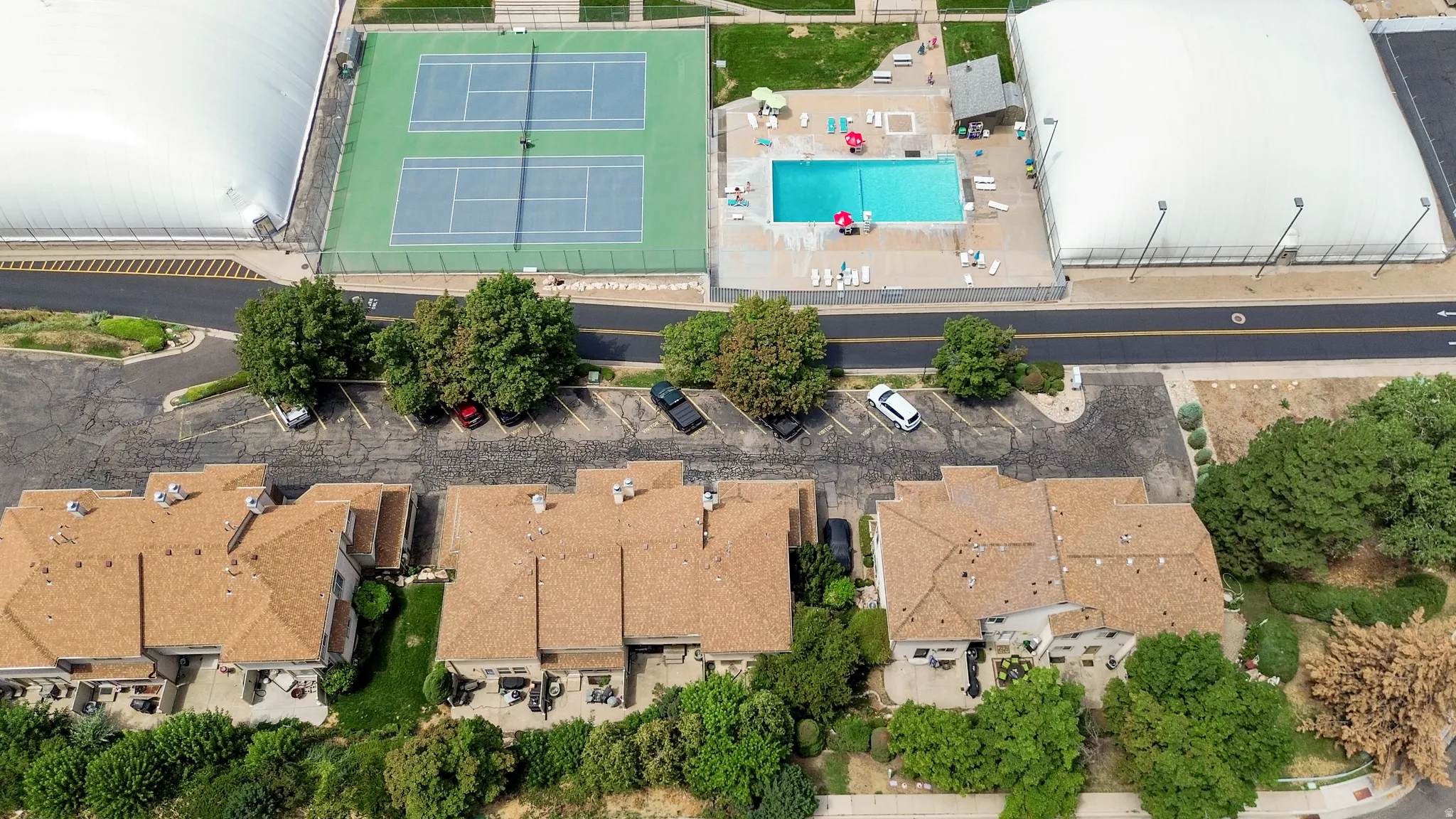 Aerial perspective showcasing a residential community with multi-level townhomes