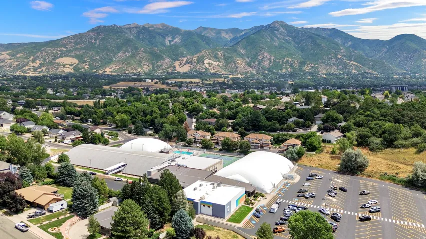 Expansive suburban landscape framed by distant mountains