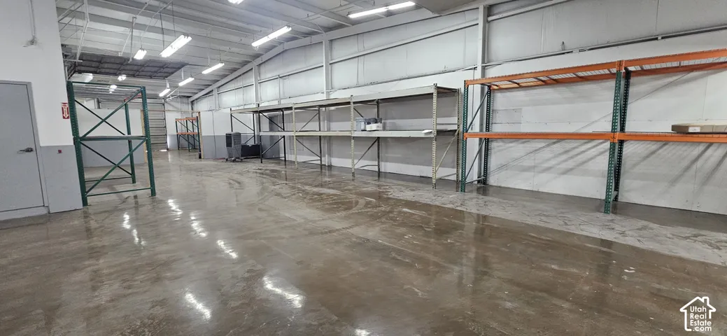 Spacious industrial interior featuring polished concrete flooring