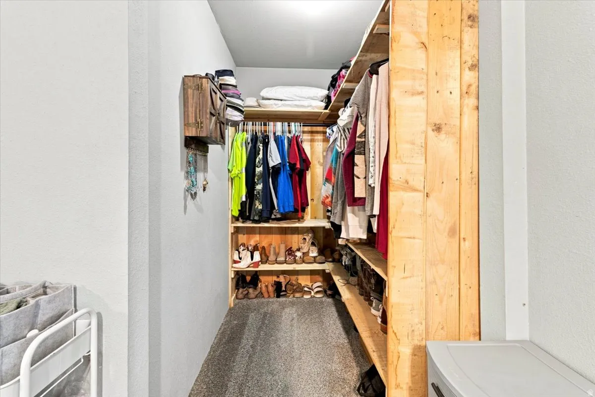 Custom wood-finish closet system featuring integrated shelving and hanging rods