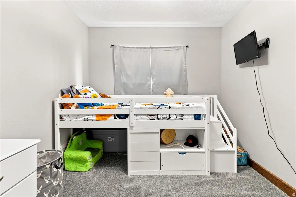 Plush gray carpeting with light gray wall paint
