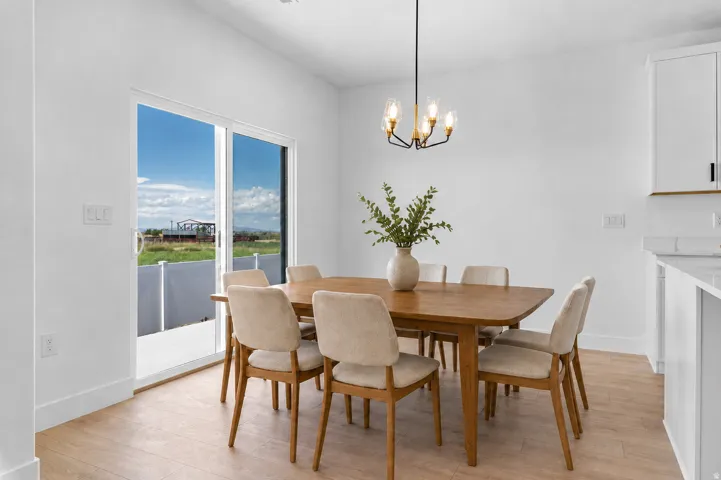 Wood-finish flooring, white walls, and a sliding glass door
