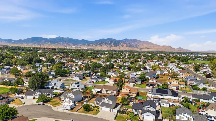 Expansive residential neighborhood featuring a variety of single-story and multi-story homes, mature trees, and paved streets