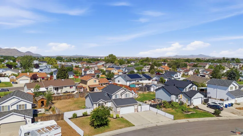 Residential neighborhood featuring a variety of single-family homes with pitched roofs and attached garages