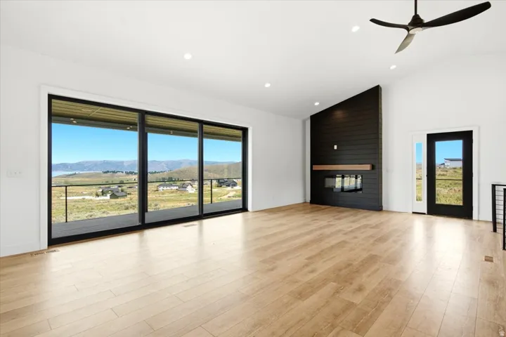 Spacious living area featuring large sliding glass doors opening to a covered patio