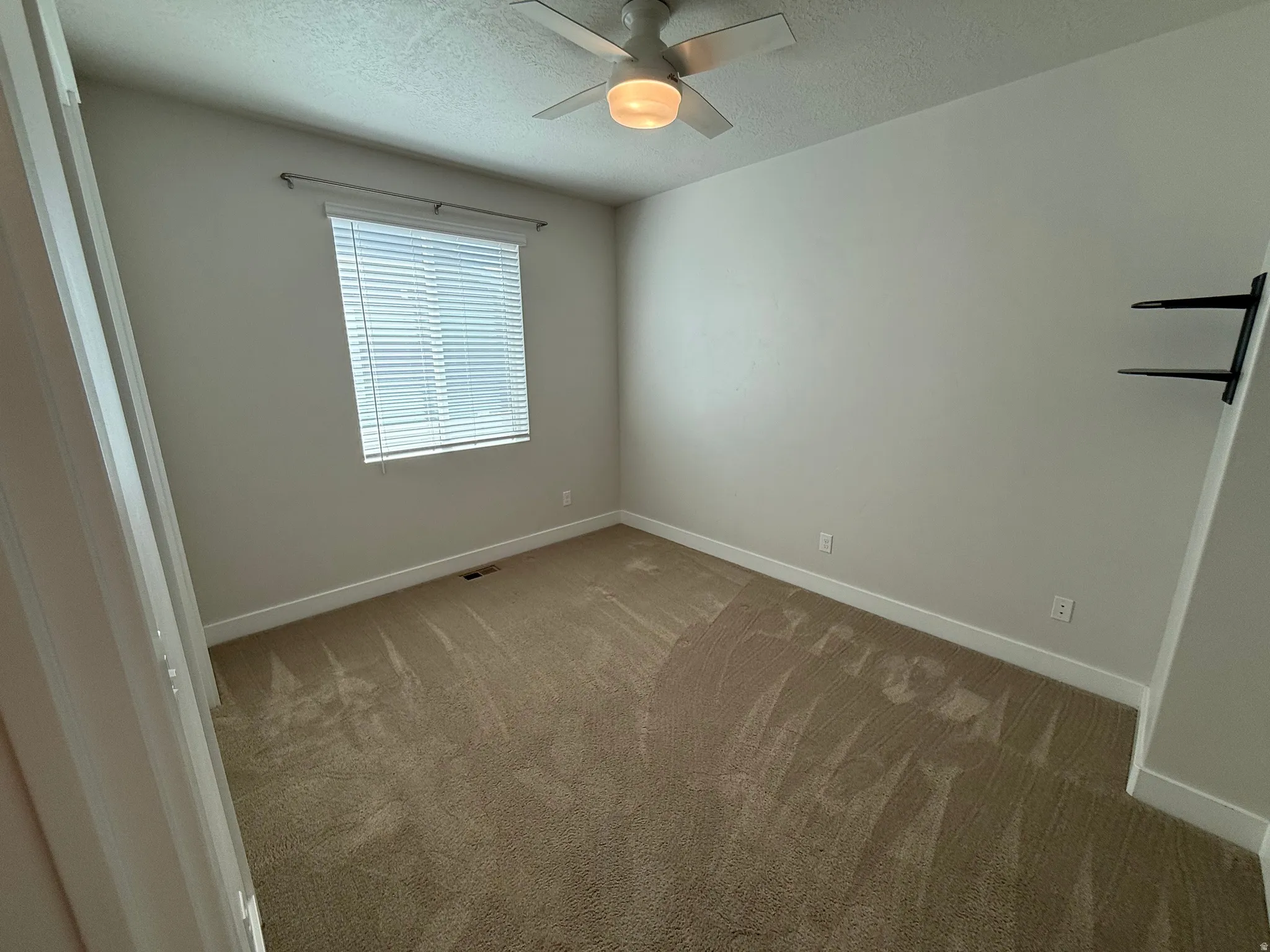 Neutral wall color with white trim