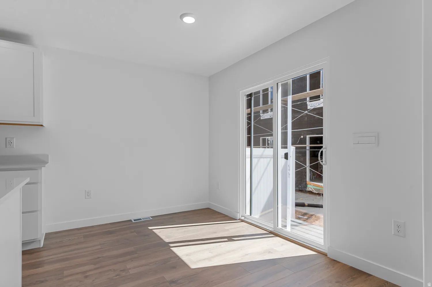 Sliding glass door opening to an outdoor space