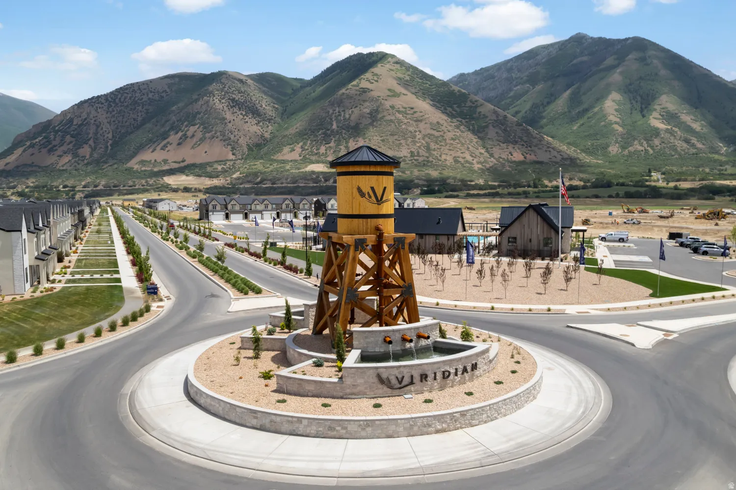 Central roundabout featuring a water tower-inspired structure on a stone base with a water feature