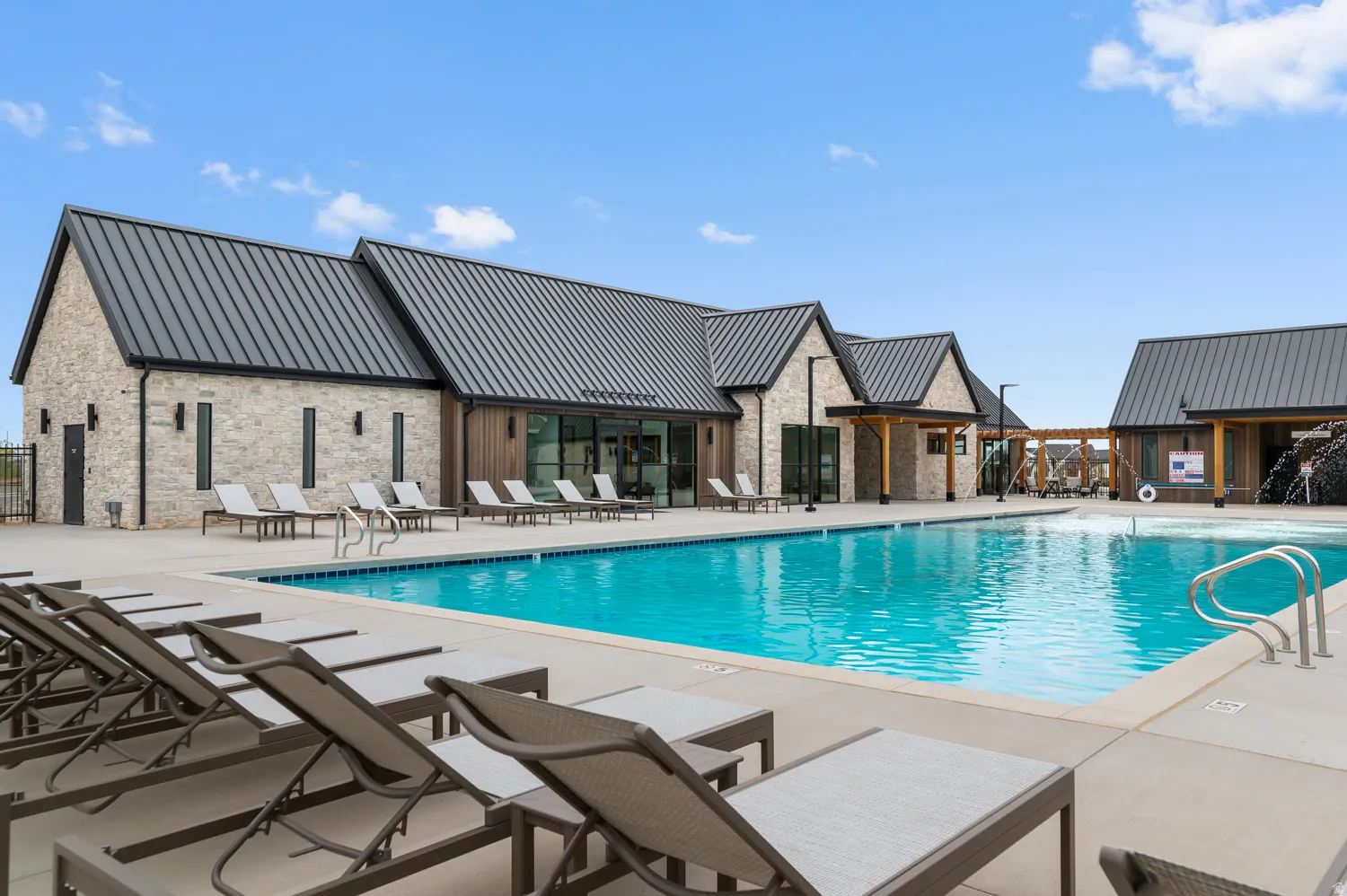 Expansive outdoor pool with integrated water features