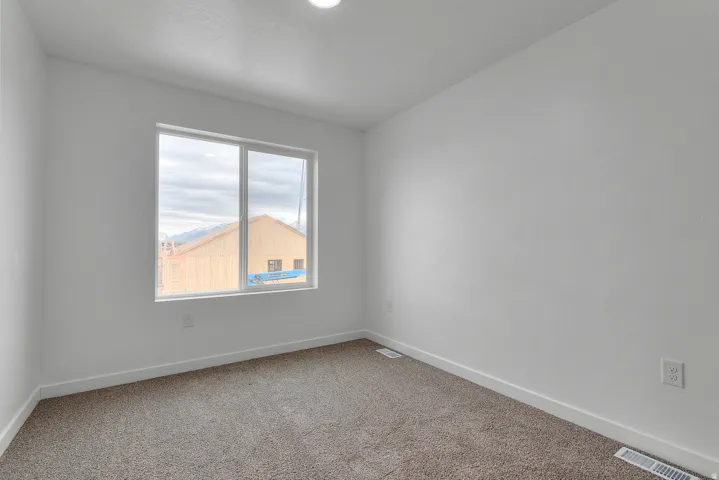 Neutral white walls paired with a large window