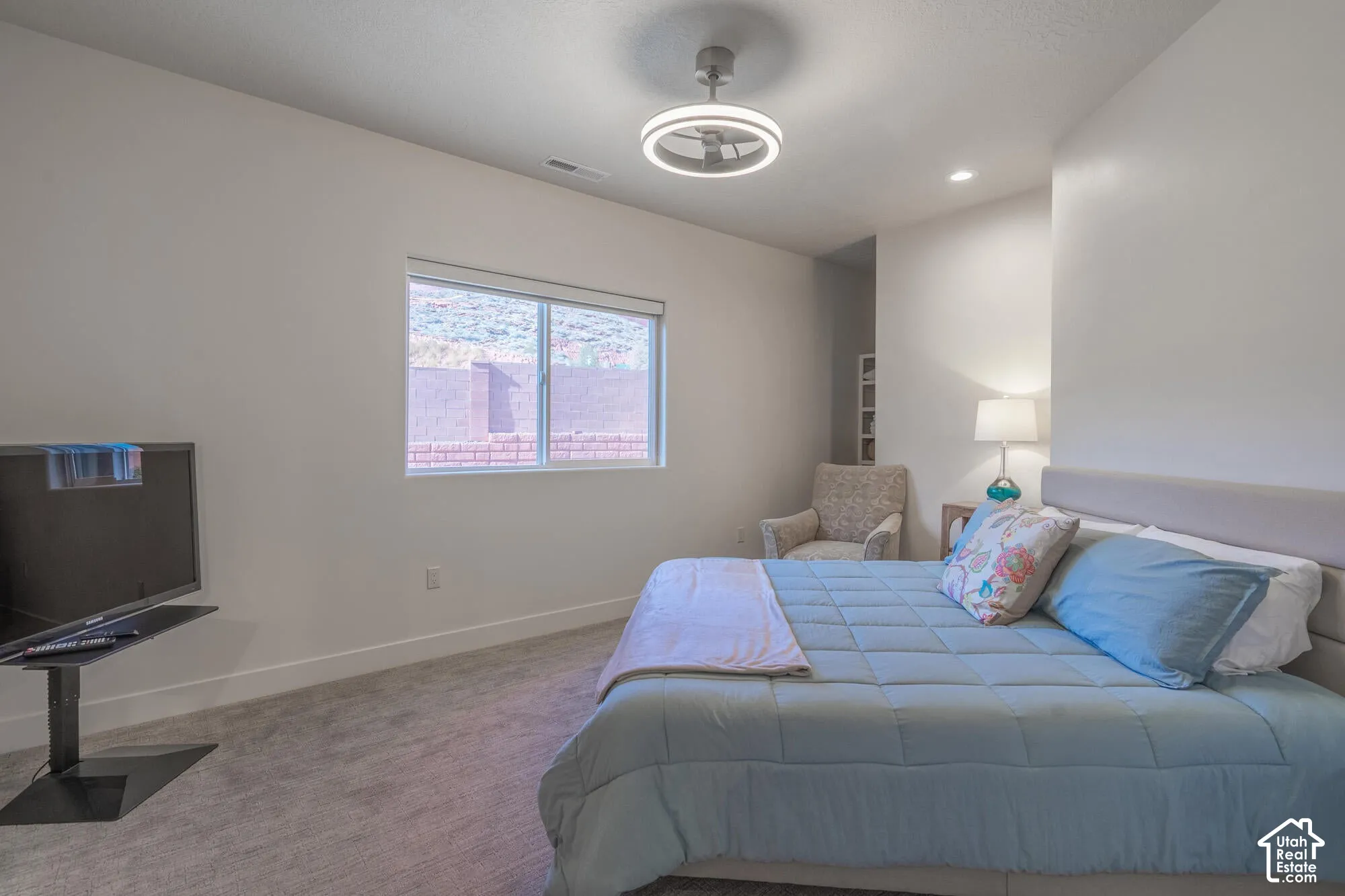 Neutral wall colors complement the textured carpeting