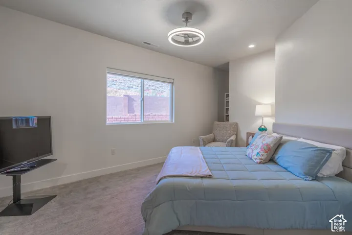 Neutral wall colors complement the textured carpeting