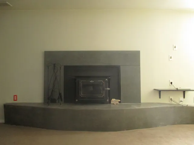 West Duplex Custom Fireplace surround with wood stove insert