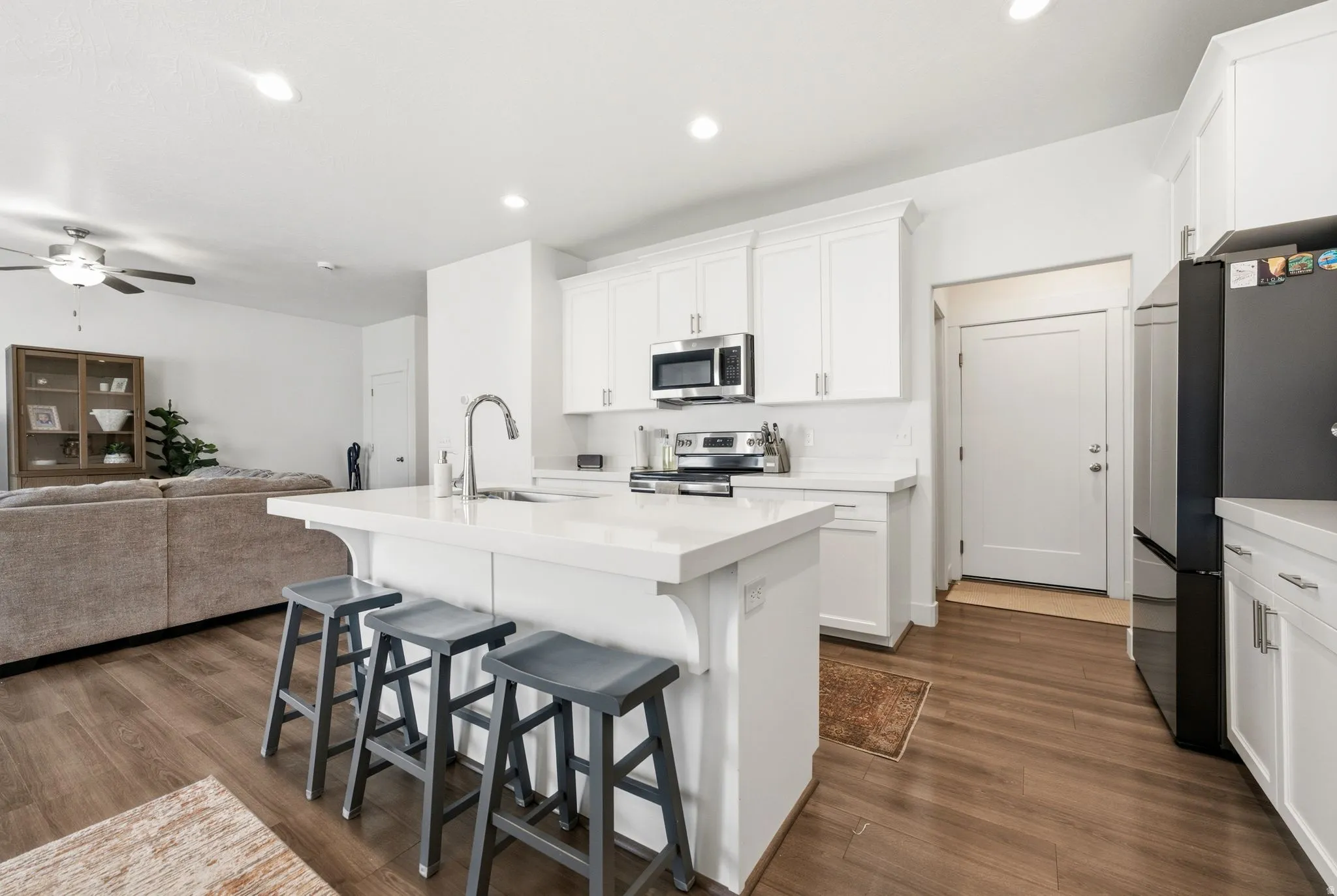Kitchen island with a single-basin sink and gooseneck faucet
