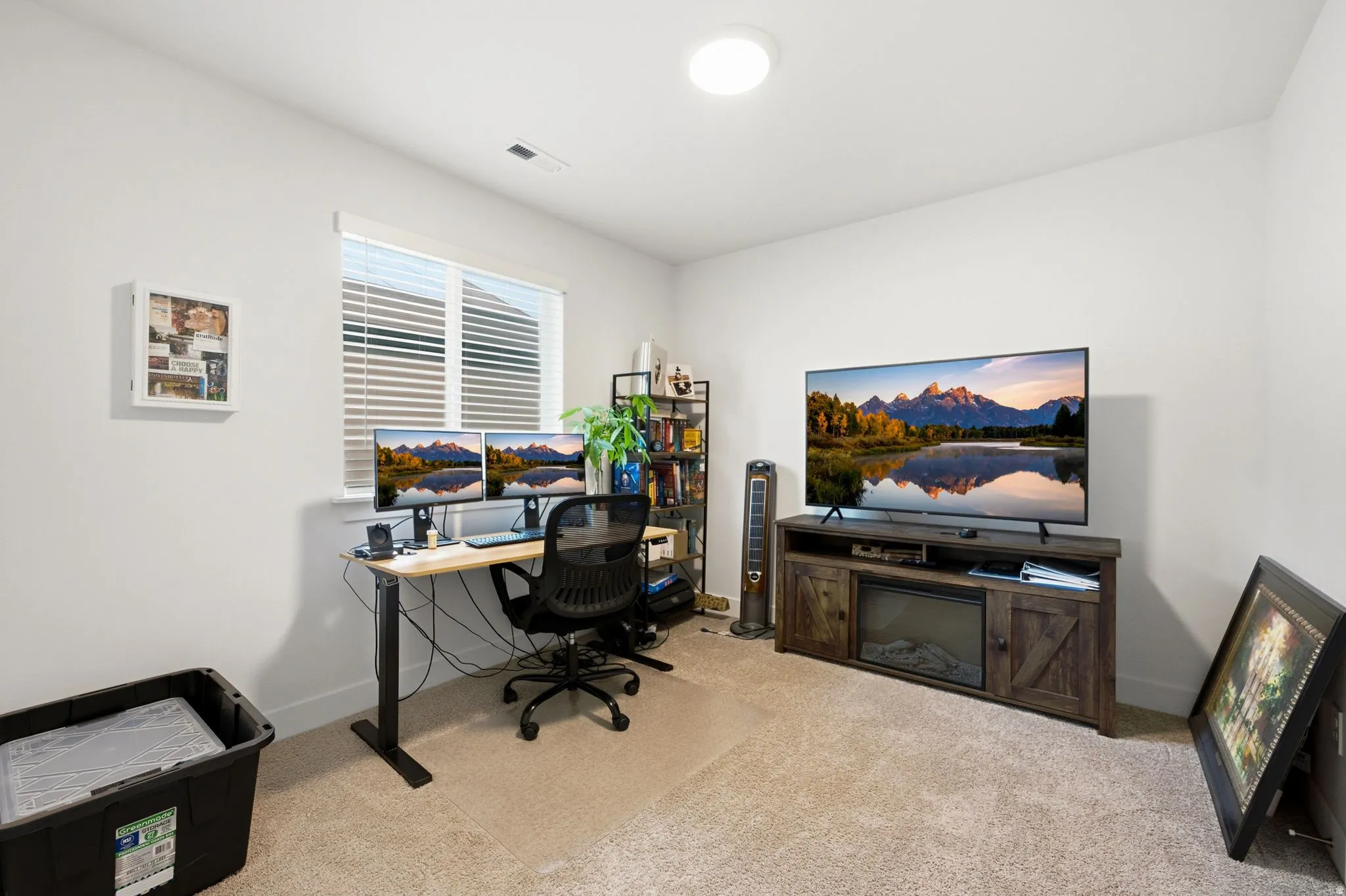 Carpeted room featuring a window with blinds, recessed lighting, and white walls
