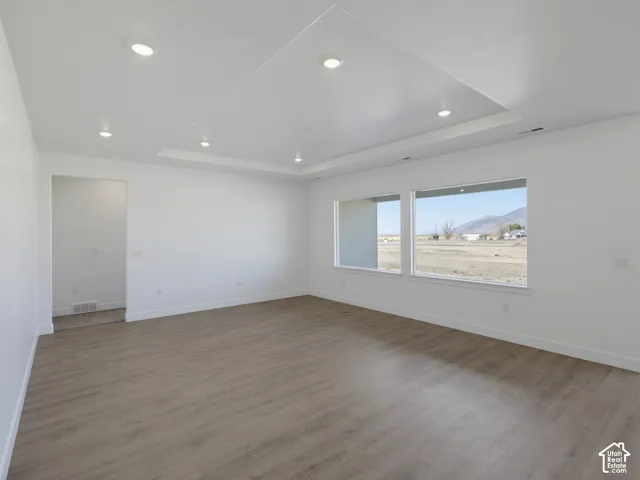 Interior featuring wood-finish flooring, a recessed ceiling, and recessed lighting