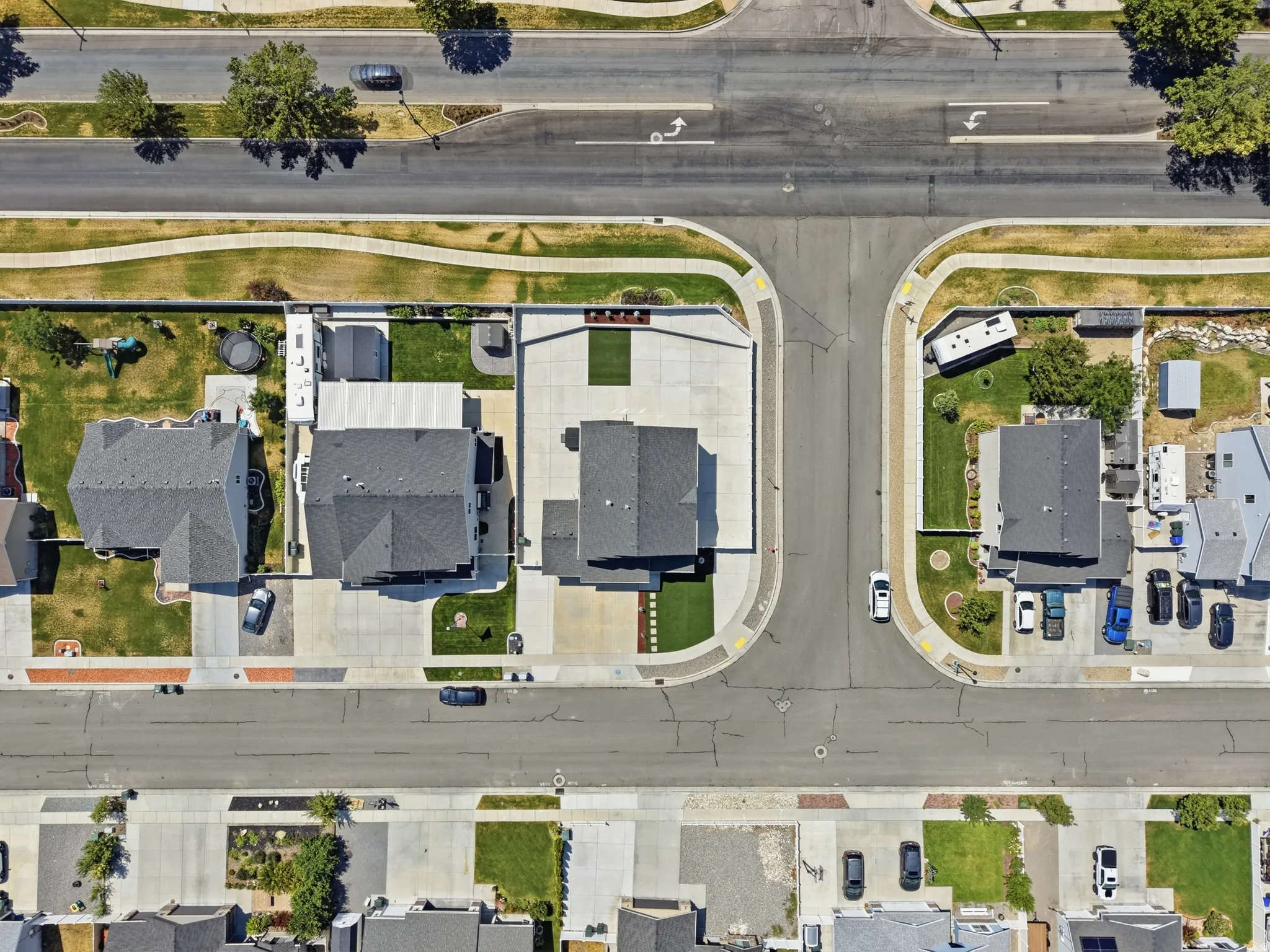 Aerial perspective showcasing a residential neighborhood with gray-roofed homes