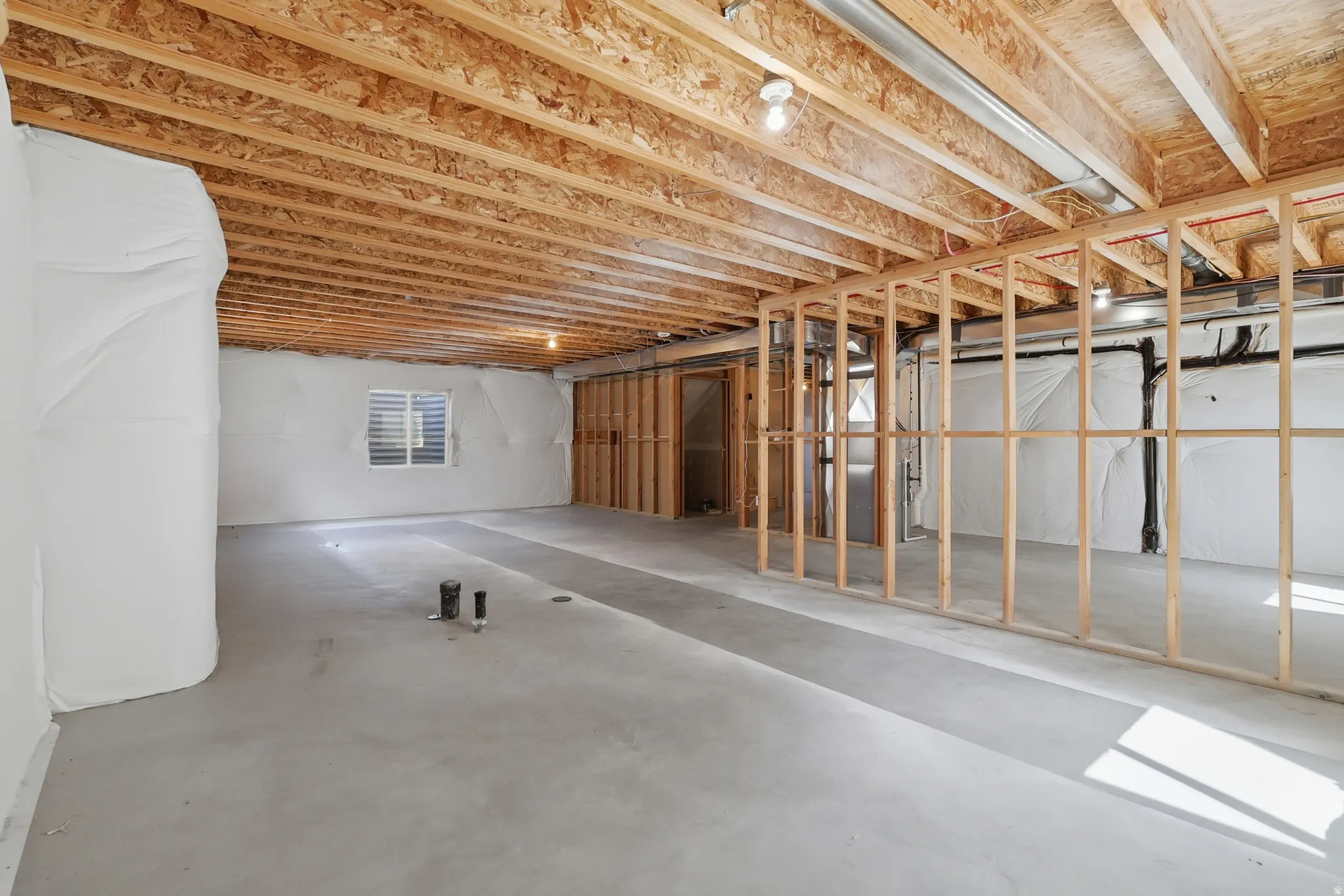 Spacious unfinished basement offering extensive potential for customization