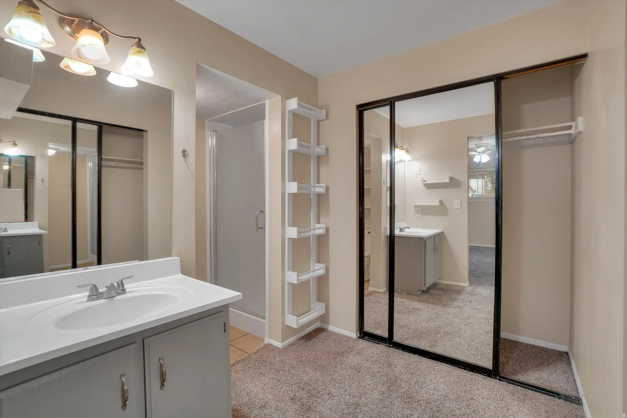 Master bathroom includes Vanity with integrated sink, chrome faucet, and under-cabinet storage