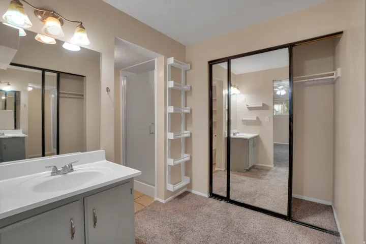 Master bathroom includes Vanity with integrated sink, chrome faucet, and under-cabinet storage
