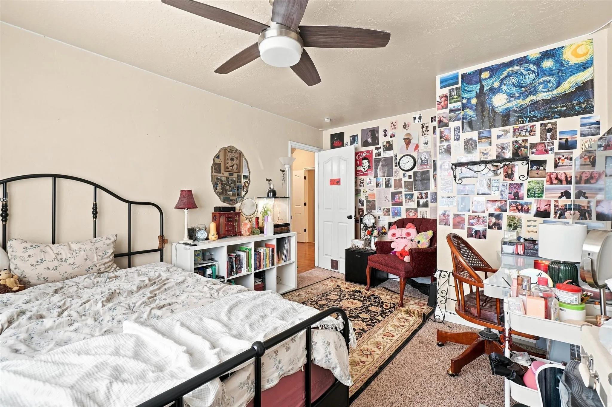 Bedroom #3 with a ceiling fan, light-toned walls, and a white interior door