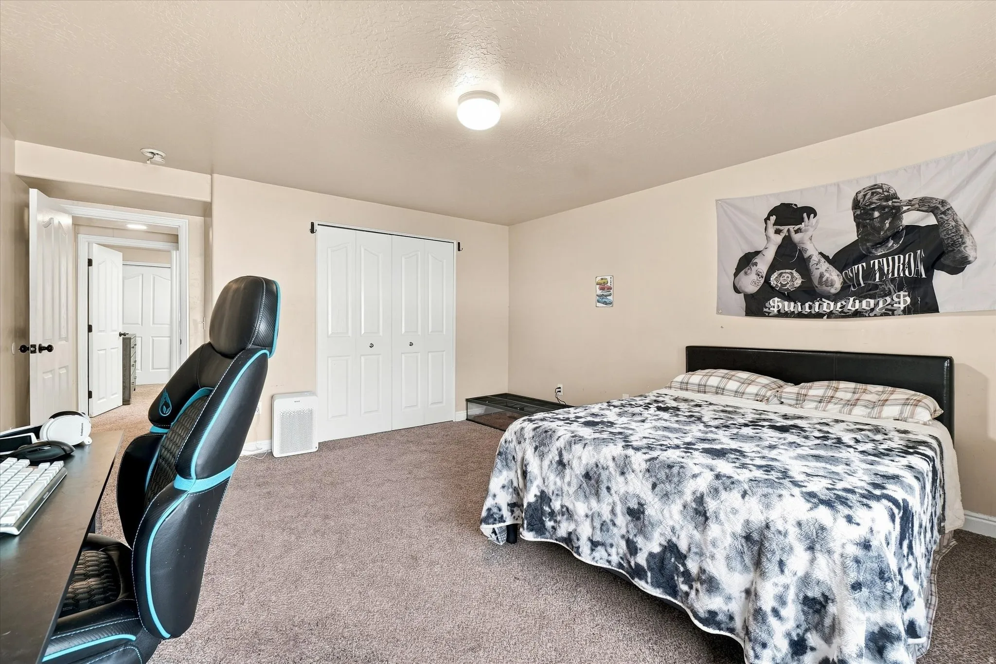 Bedroom #5 featuring a ceiling-mounted light fixture, bi-fold closet doors, and light-toned wall paint