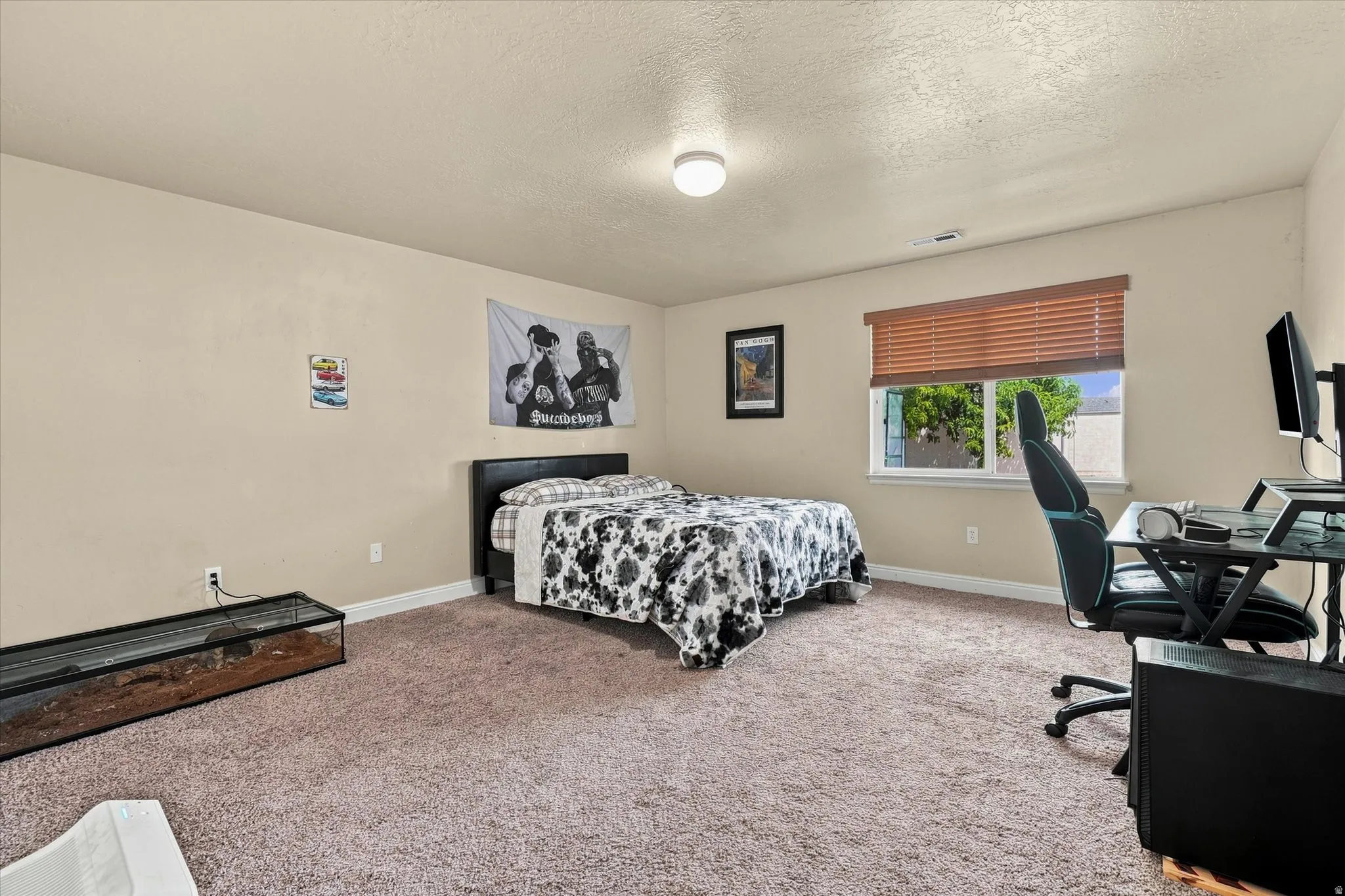 Bedroom #5 featuring neutral-toned walls, a single window with horizontal blinds, and an overhead flush-mount light fixture