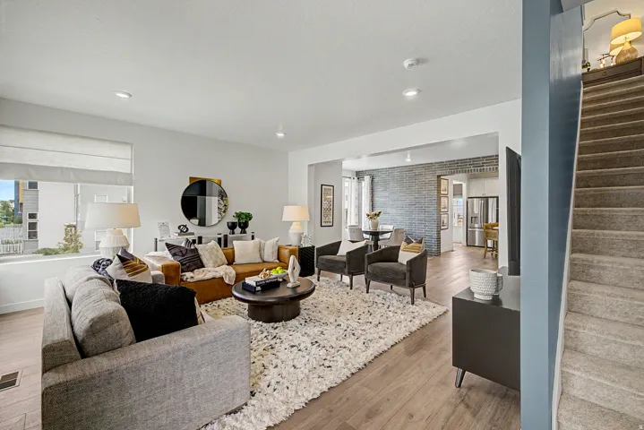 Open-concept living space with wood-finish flooring