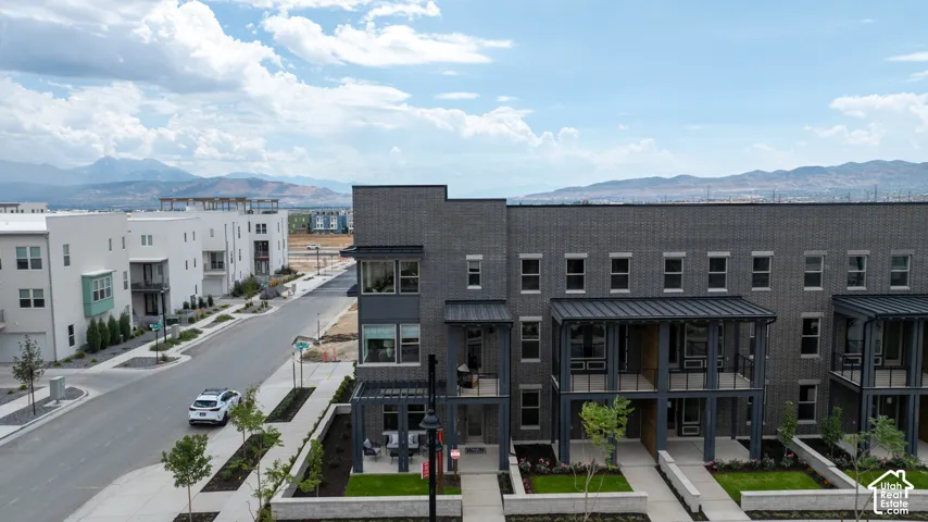 Modern townhome exteriors featuring dark brick and metal accents