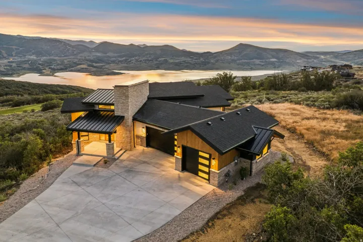 Contemporary residence with a stone and wood-panel exterior