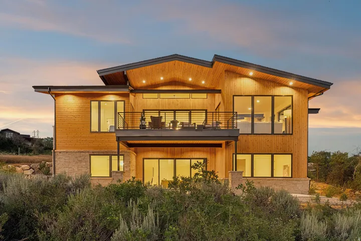 Contemporary architectural design featuring wood siding and stone accents
