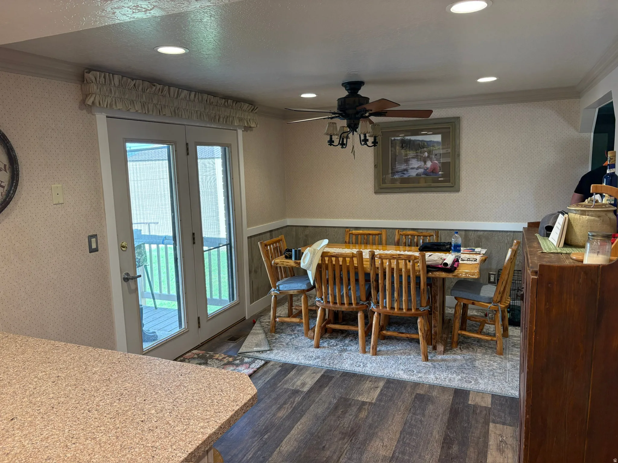 Dining area featuring wood-finish flooring and recessed lighting